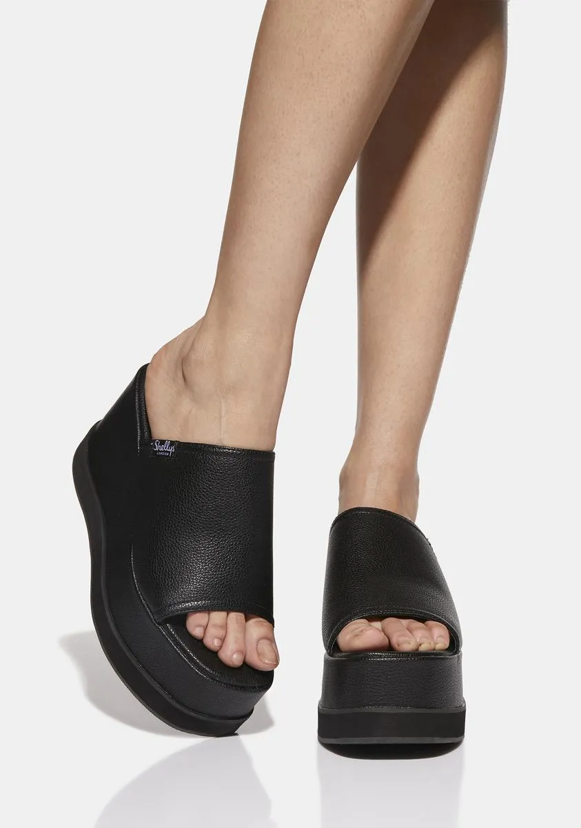 Black mules with bubble platforms