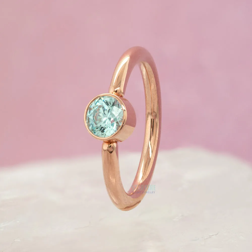 Captive Bead Ring (CBR) in Gold with Bezel-set Cyan CZ Captive Bead