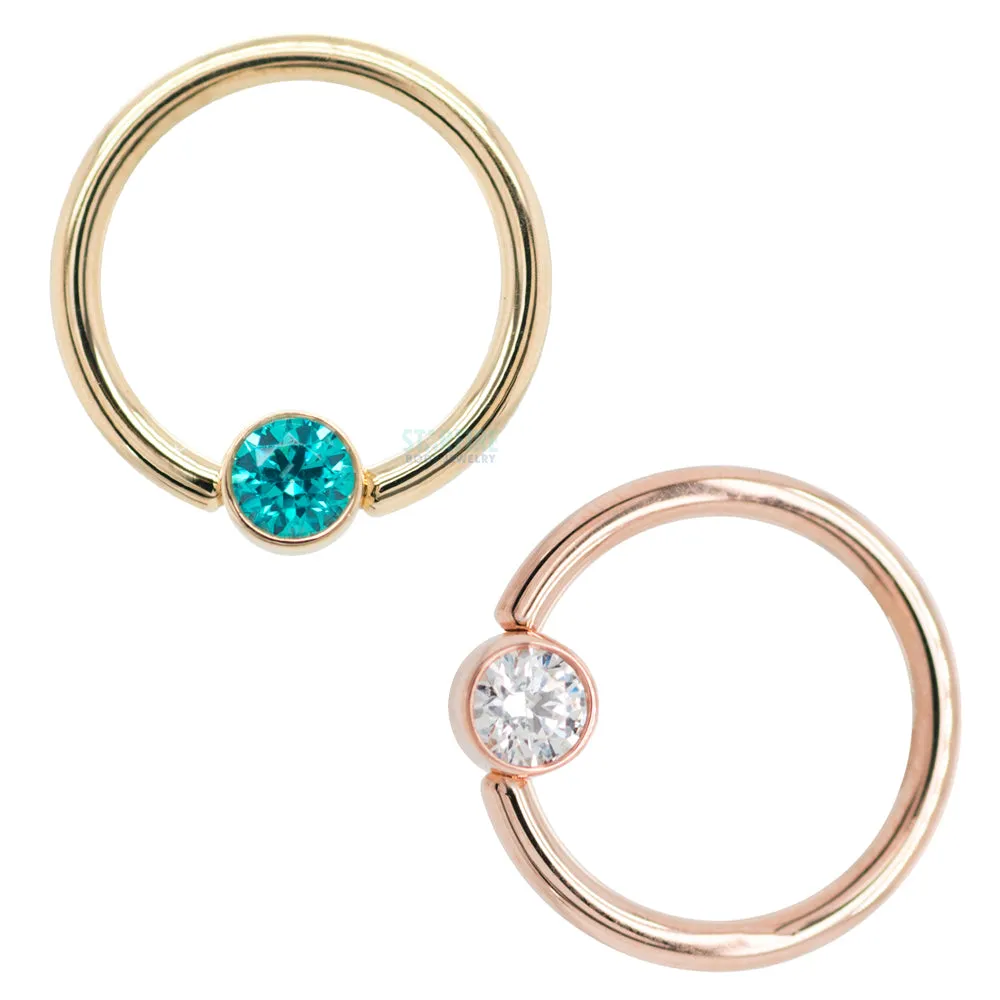 Captive Bead Ring (CBR) in Gold with Bezel-set Cyan CZ Captive Bead