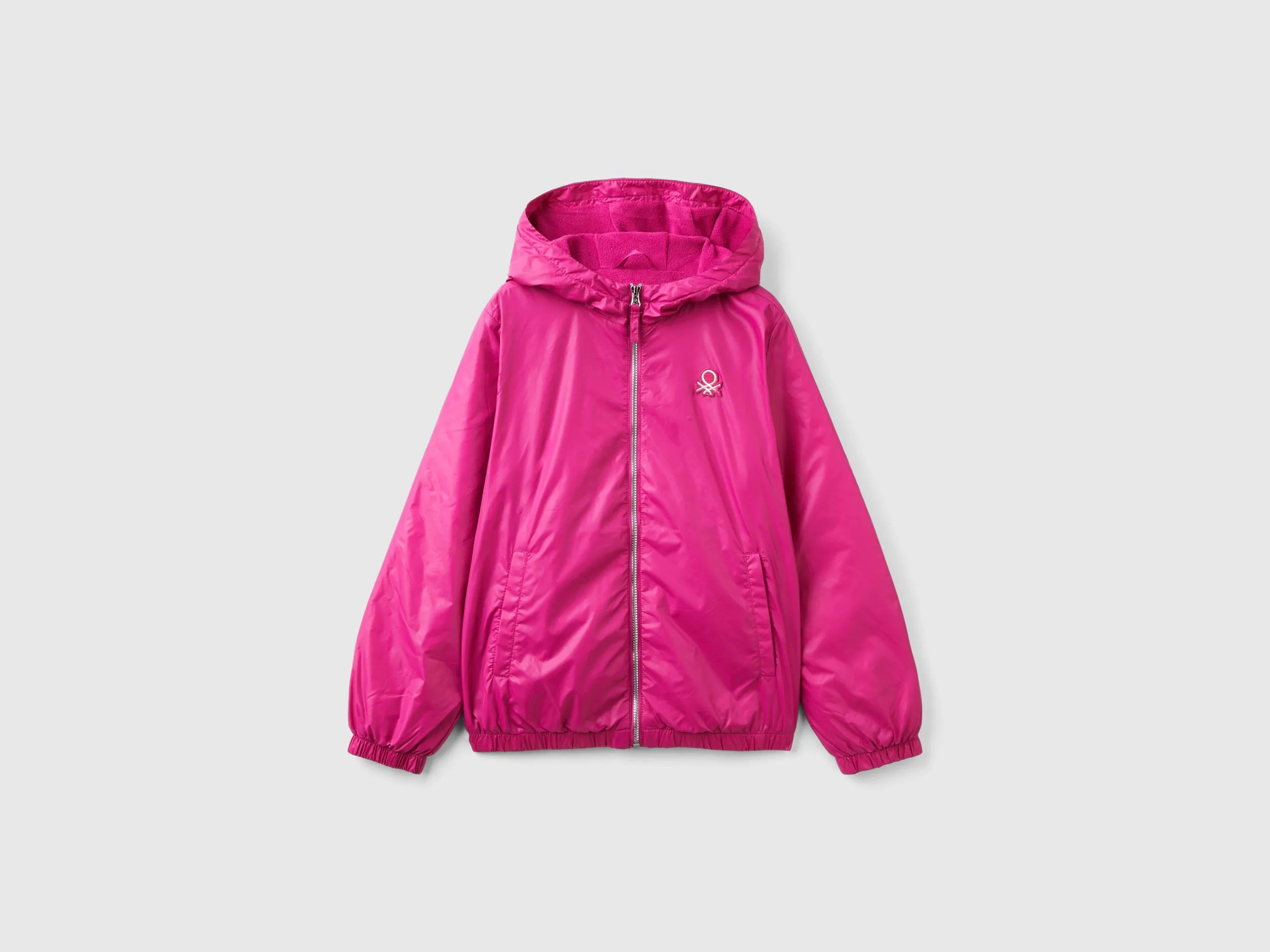 Glossy jacket with zip and hood - Fuchsia | Benetton